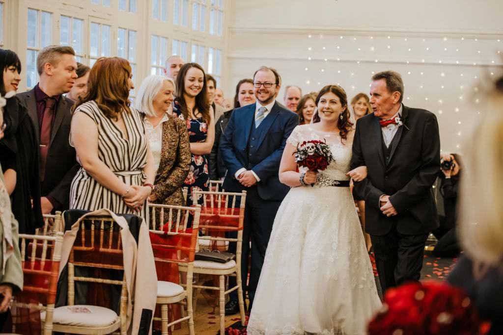 Wedding ceremony , white dress, black suit, red shirt, ring ceremony