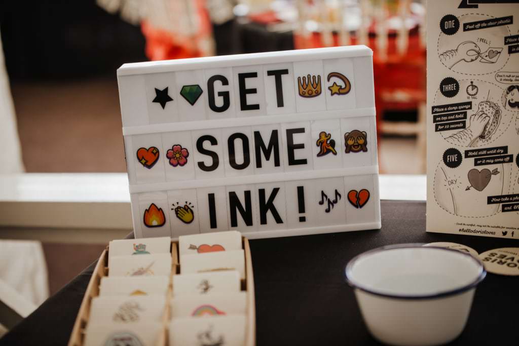 Dancing couple at the wedding reception Shenley cricket club , white wedding dress, black and red themed wedding