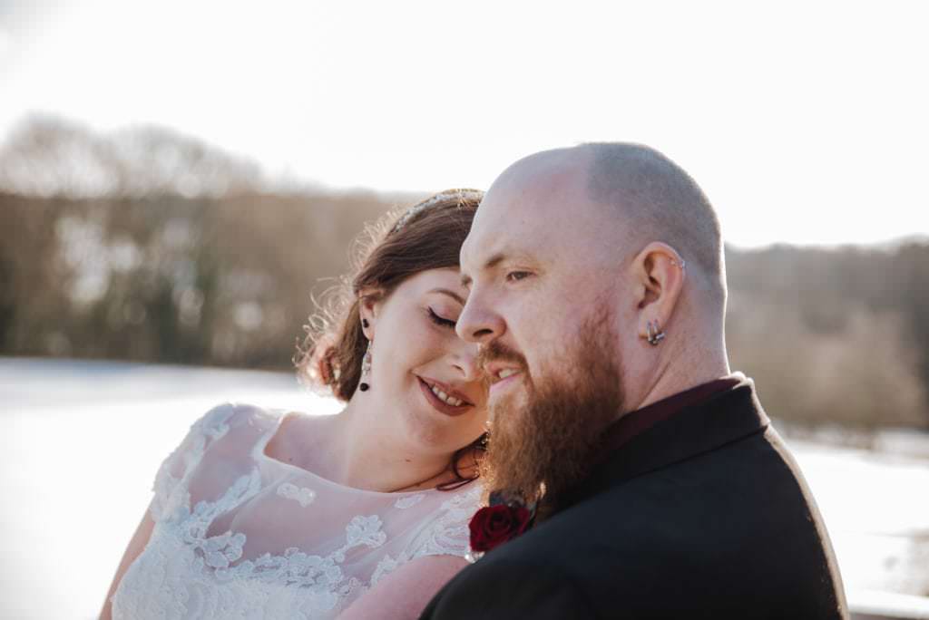 Sarah and Sam weddiing couple outside Shenley Cricket club for thei