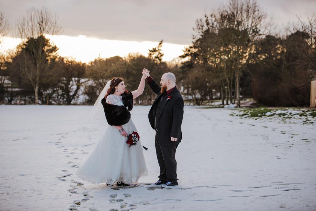 Sarah and Sam weddiing couple outside Shenley Cricket club for thei