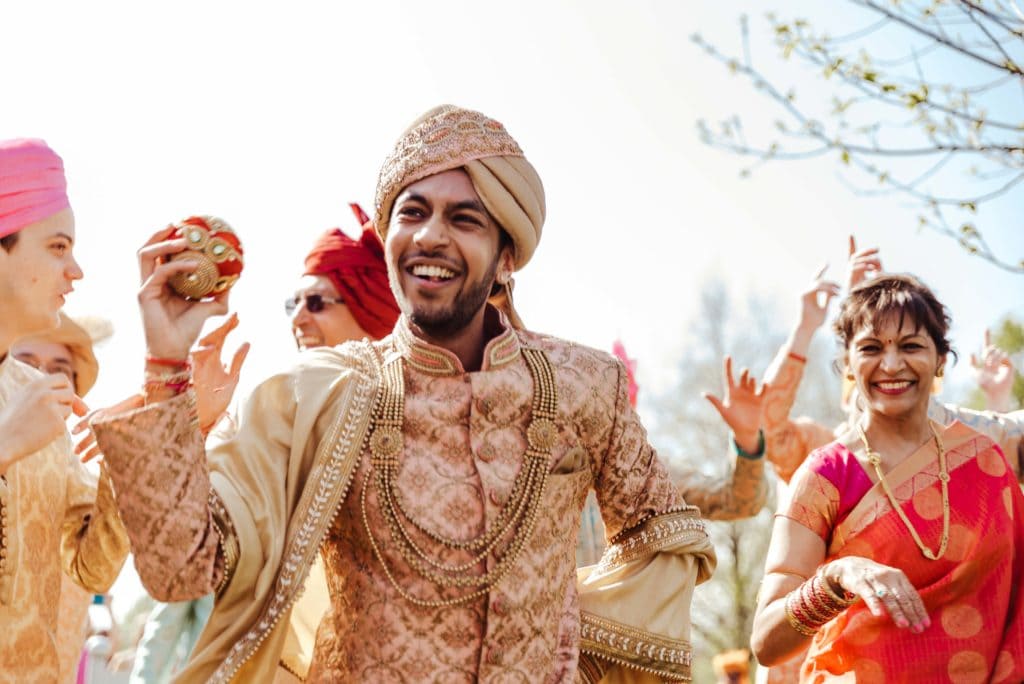 Groom dancing to dollies to the alter